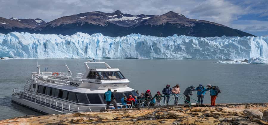 El Calafate: Safari Azul Los Glaciares Trekking Tour - Walking through forest, sand, and stone