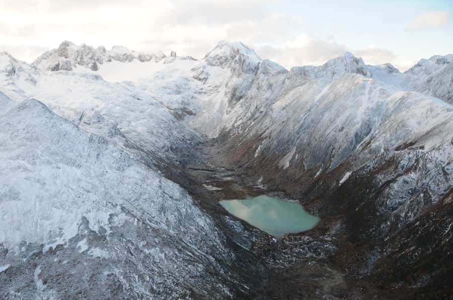 Emerald Lagoon Helicopter seeing - Leaving Ushuaia above the bay