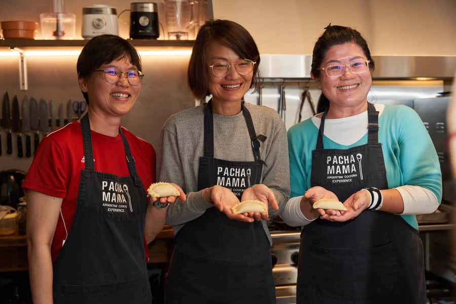 Pachamama - Argentine Cooking Experience in Buenos Aires - Folding beef empanadas and mixing chimichurri